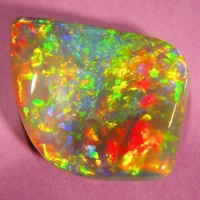 Opal with freeform shape and undulating face